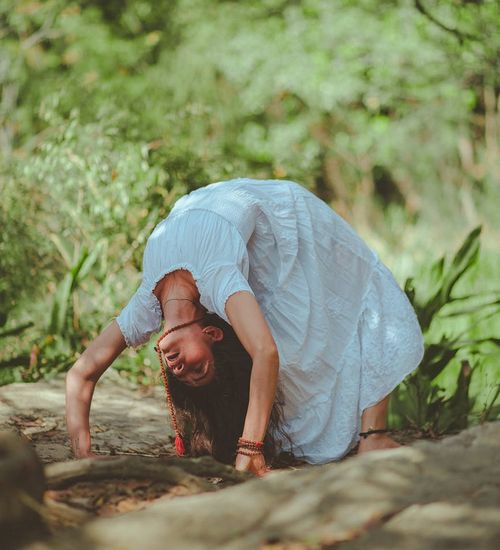 Person meditating in a calm and natural environment.